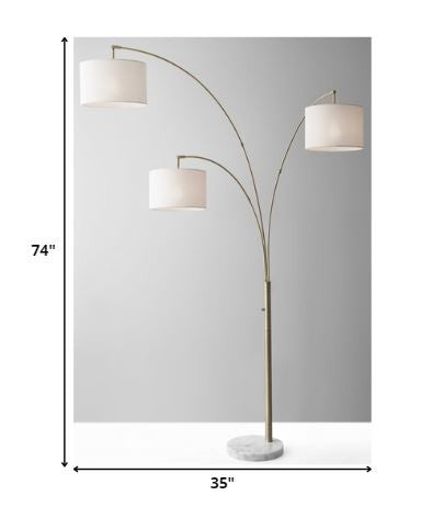 74 Brass Three Light Tree Floor Lamp With Off White Solid Color Drum Shade